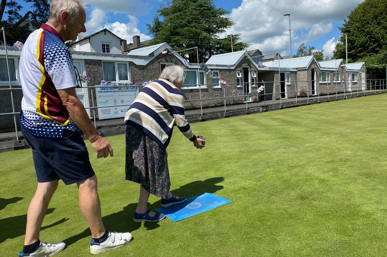 Tavistock's Sir Francis Drake Bowling Club gives a user of Tavistock Area Support Services a taster coaching session in lawn bowls.