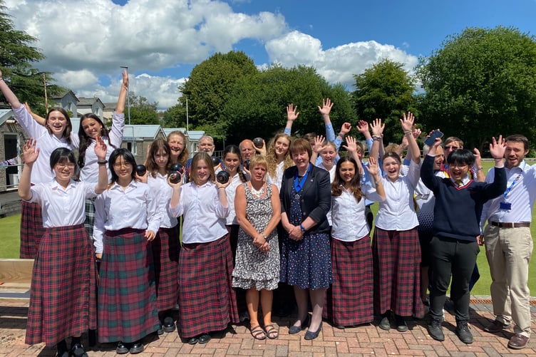 Musical Mount Kelly College students reach the high note to mark Tavistock Area Support Services fortieth birthday on the bowling green.
