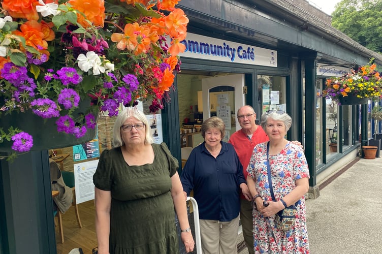 Volunteers from Tavistock Area Support Services (TASS) Community Cafe are nurturing their colourful hanging baskets.