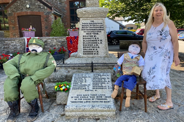 Jane Poulton, of Bere Alston in Bloom organising team with the war memorial scarecrow competition entries.
