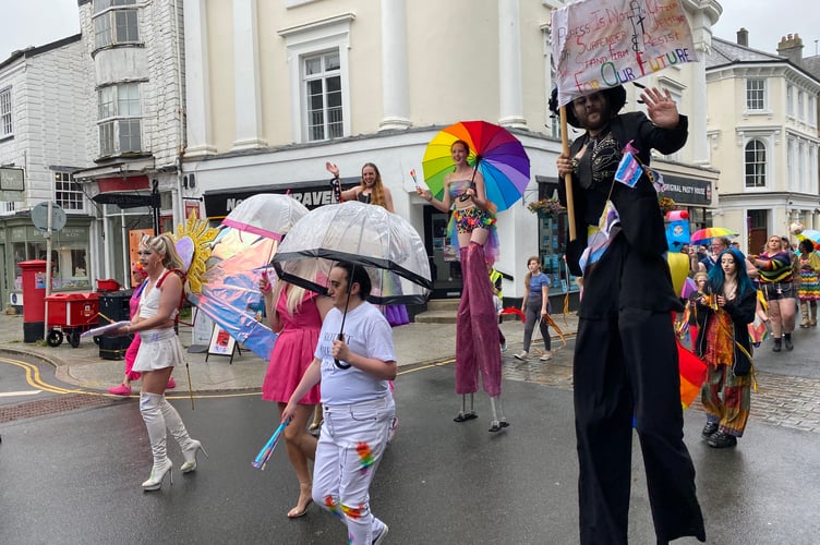 Rosie Rainbow Circus stilt walkers and others add colour and skills to Tavi Pride's procession.