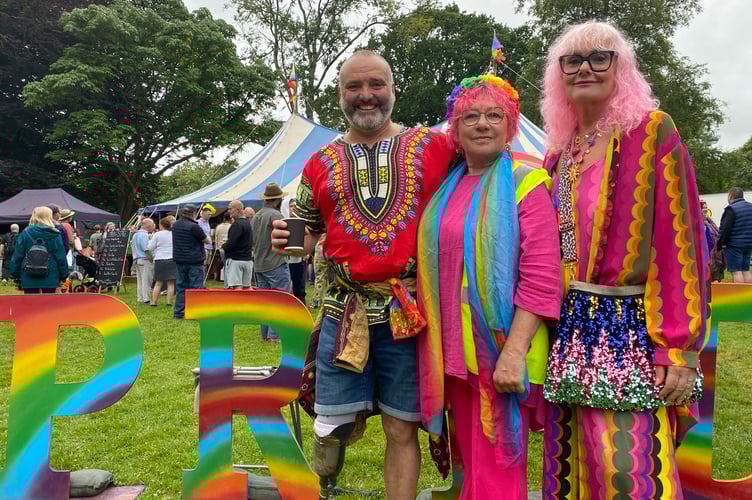 Lee and Clare Spencer  and  Pauline Ricketts enjoying Tavistock Pride's joyous celebrations on Saturday (July 5).