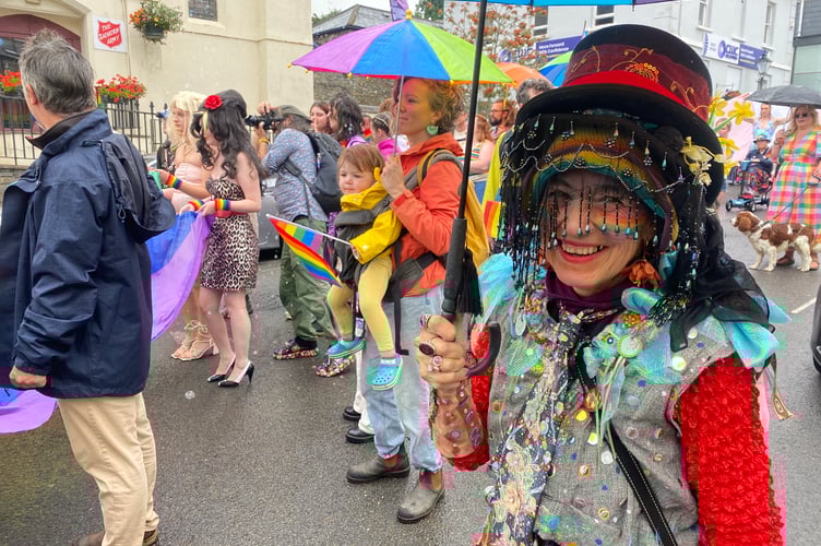 Keeping the rain away while making a colourful splash on Tavistock Pride's procession.