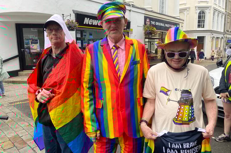 Three friends making a fashion impression, on Tavi Pride's town centre procession.
