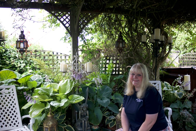 Claire White is rightly proud of  her and husband Mark's admired floral home in Lamerton which is equally pretty in the back garden. Picture by Jude Wright.