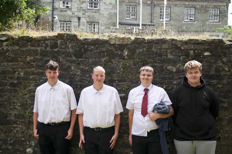 Relieved their exams are over - Tavistock College friendship group Chris, William, Morgan and Liam who joined their GCSE graduation ceremony in St Eustachius' Church in Tavistock. Picture by Jude Wright.