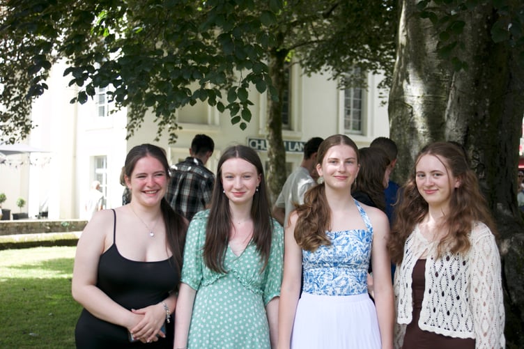 Tavistock College students Daisy, Anya, Rose and Jess dressed for the GCSE graduation ceremony in St Eustachius' Church on Wednesday (July 9). Picture by Jude Wright.