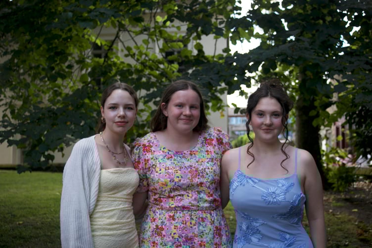 Group Relieved their exams are over - Tavistock CHappy their exams are finally over are friends Mia and Jessica from Tavistock College who joined their GCSE graduation ceremony in St Eustachius' Church in Tavistock. Picture by Jude Wright.