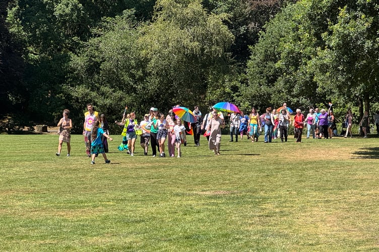 The front of the group of walkers in Simmons Park on Okehampton Pride day. AQ 6493