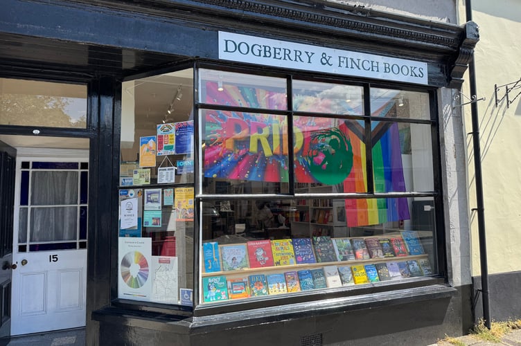 Pride flags on display at Dogberry and Finch Books for Okehampton Pride. AQ 6462