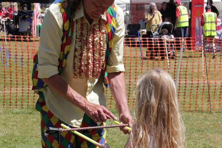 Learning circus skills at Tavistock Lions Fun Day in The Meadows. Picture by Steve Grummitt.