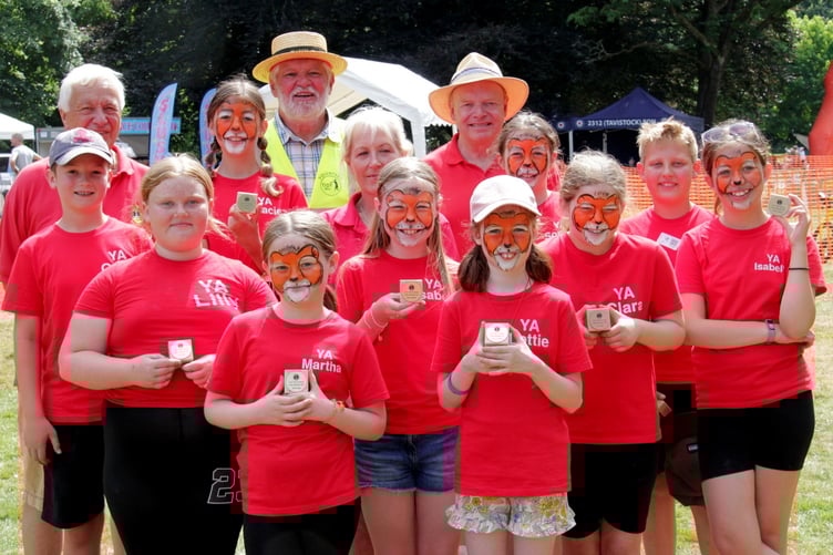Lions' Young Ambassadors enjoying themselves and supporting the Tavistock Lions Fun Day in The Meadows as part of the town's carnival week. Town Mayor Cllr Steve Hipsey is pictured at the back in the luminous jacket.