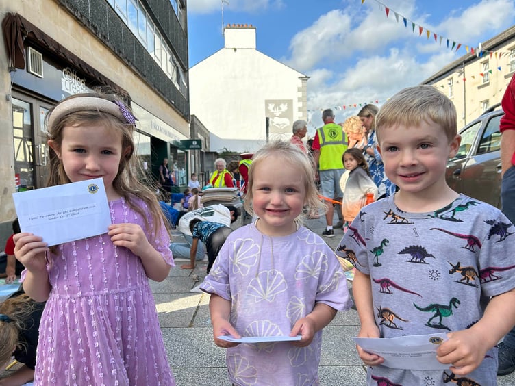 Pictured are the Under 5s pavement art winners: Chloe McCormick, third; Olivia Thorne, second; and Lucas Ball, first.
