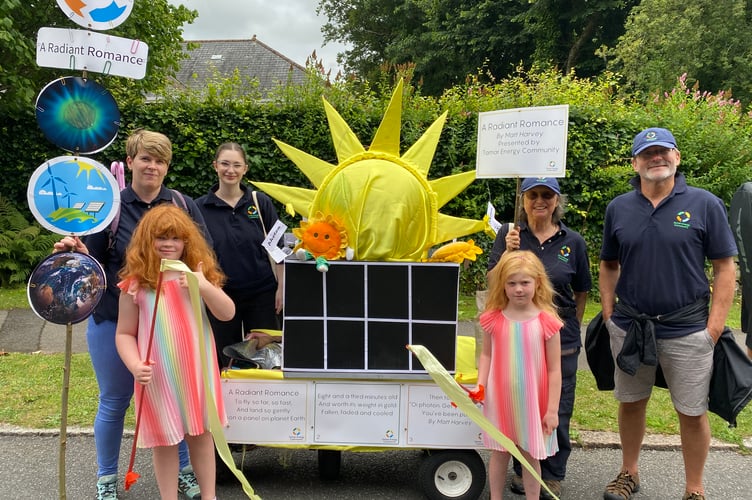 Tavistock Energy Community using poetry to show the journey of the sun's energy to solar panels in Tavistock Carnival.