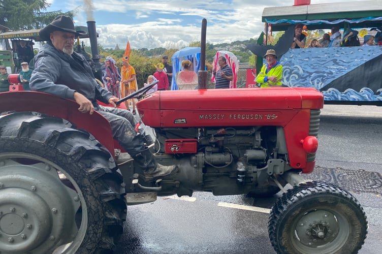 A vintage tractor taking it slowly at Tavistock Carnival.