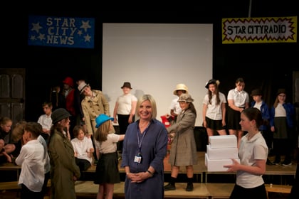 Retiring Tavistock Primary School head. Laura Handel surrounded by children rehearsing their end of school musical. Picture by Jude Wright.