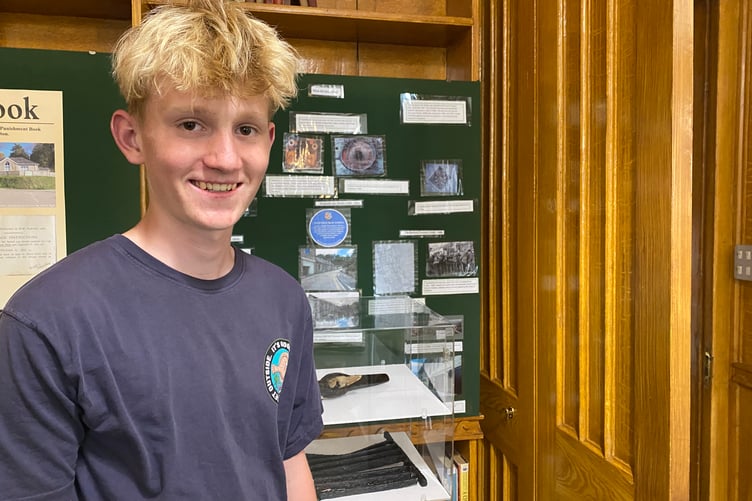 Seth White, 15, is setting up a museum collection exhibit at Tavistock Museum for his Duke of Edinburgh award.