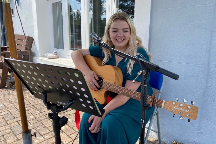 Milly Plokker, who works in the kitchen of Drake Lodge, on Plymouth Road Tavistock, entertained staff, guests and residents at the accommodation's summer fair.