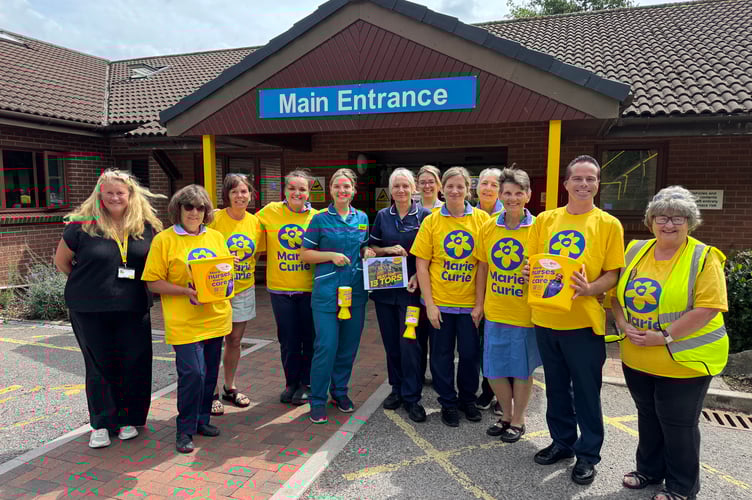 The Crediton Community Nurses who will take on the 13 Tors of Dartmoor trail in aid of Marie Curie with Marie Curie representative Mandy Fosbrooke, left, and Hazel Evely, Crediton Morrisons Community Champion, right, Morrisons big supporters of Marie Curie.  AQ 6831
