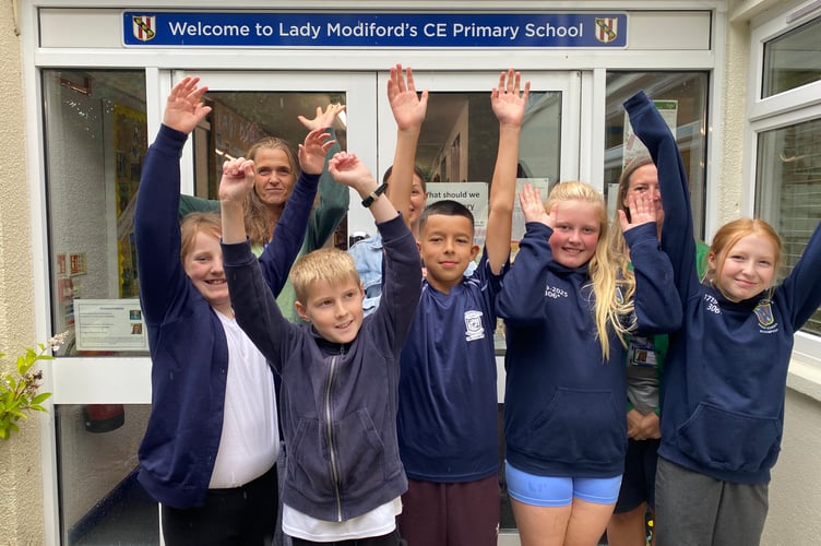 The final pupils at Lady Modiford's Primary with Sarah Reid, deputy head (left) and Joanne Davey, teaching assistant (right), during the last week before the school closed down.  