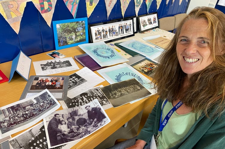 Lady Modiford Deputy Headteacher Sarah Reid looking at the huge collection of memorabilia donated to a pop-up exhibition to mark potentially the last time the  school opens.