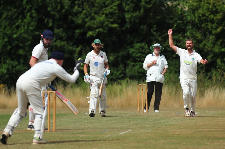 Devon Cricket League E Division West. Stokeinteignhead 1st XI versus Whitchurch Wayfarers 1st XI. Delight for Whitchurch bowler Darren Sambells as Stoke's Oliver Hastie is caught by 'keeper Nigel Barriball