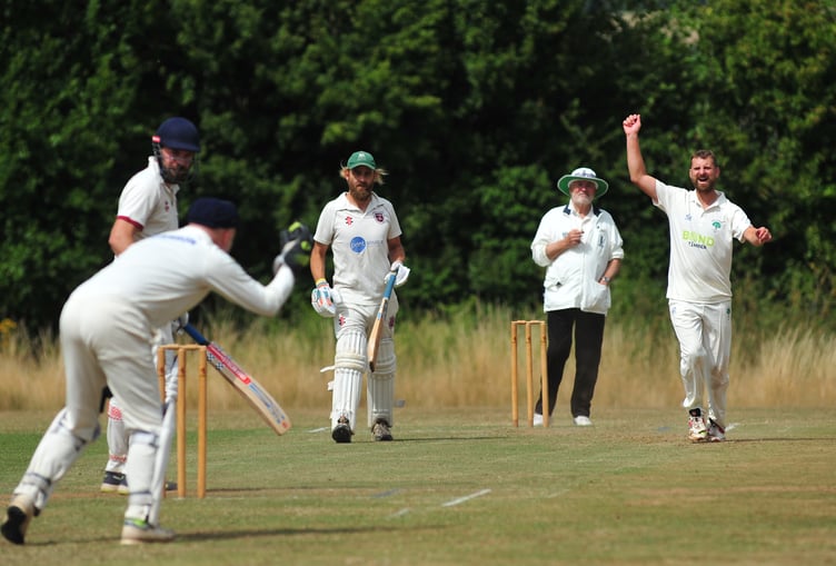 Devon Cricket League E Division West. Stokeinteignhead 1st XI versus Whitchurch Wayfarers 1st XI. Delight for Whitchurch bowler Darren Sambells as Stoke's Oliver Hastie is caught by 'keeper Nigel Barriball
