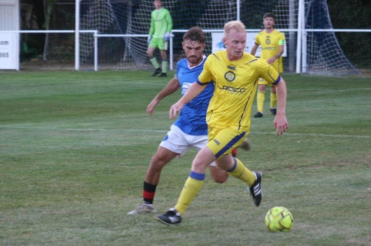 Okehampton Argyle fullback in possession