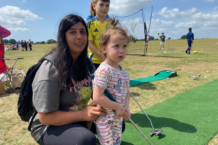 A hole in one for three family members Daniella Stevens and daughter Wren, 3, with Samuel, 7, at Yelverton Fun Day