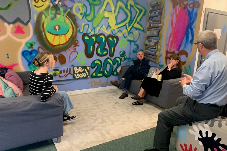 MP Sir Geoffrey Cox, Tavistock and Torridge MP (pictured centre) dropped in to see Bere Alston’s Youth 2 Youth group based at The Hut. The MP discussed the difficulties of funding youth provision.