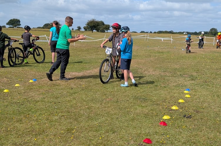 Young mountain bikers from Dartmoor Velo get competitive at Yelverton Fun Day on the airfield. Picture by Dartmoor Velo.