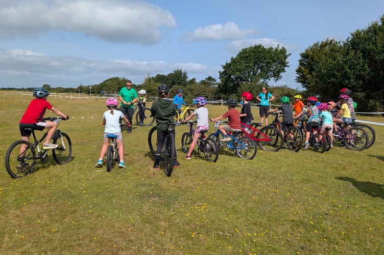 Mini-mountain bikers from Dartmoor Velo get competitive at Yelverton Fun Day on the airfield. Picture by Dartmoor Velo.
