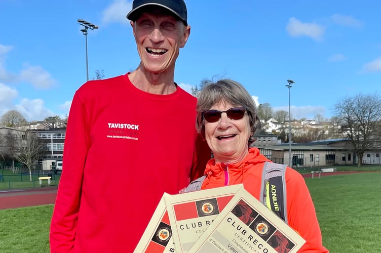 Val with some of her club records, with Tavistock Athletic Club's Allan Herdman.
