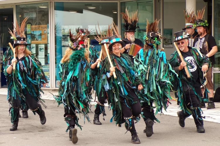 Lodestone Border Morris perform in a town centre.
