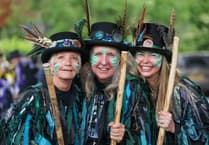 Tavistock Morris dancers shaking bells to mark 20 years