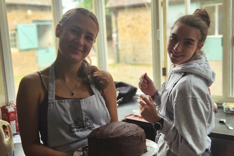 No soggy bottoms as Duke of Edinburgh students bake up a storm providing cakes for the open garden refreshments.