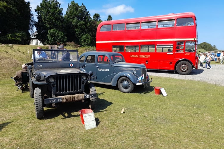 A vintage double-decker bus ran a service between the show site and Yelverton Parade, where the shops had dressed their windows with flags, 1940s signs, and pictures.