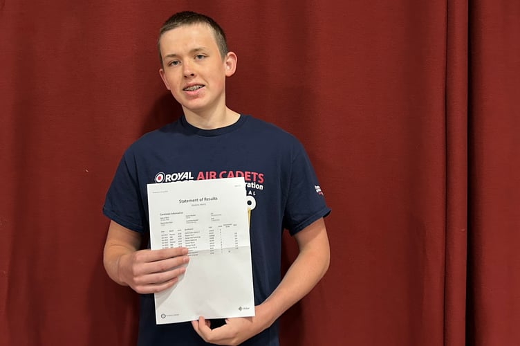 Henry Hoskins with his results.
