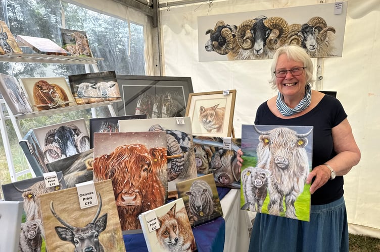 Janet Jarvis, animal artist, from North Tawton, works in pastels and acrylics and enjoys painting farm animals, wildlife and pets. She had a stand with some of her work on sale at Chagford Show. AQ 1003