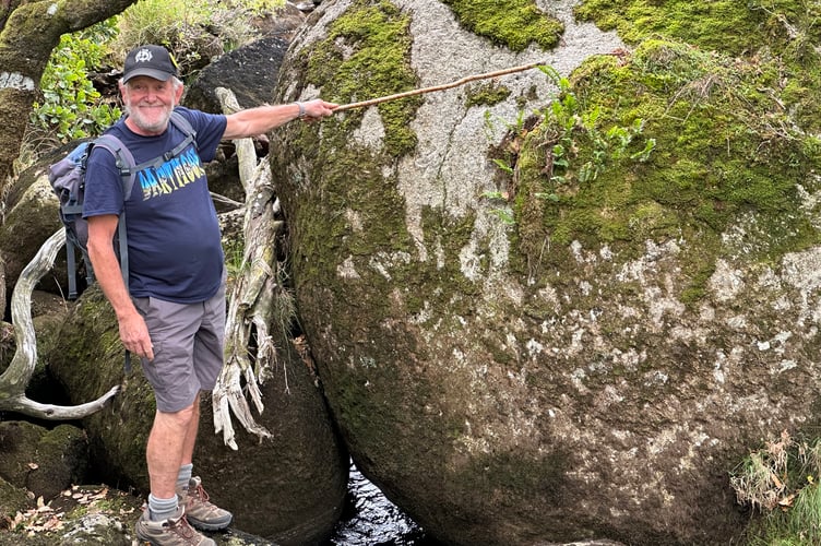 Kevin Glover at Black-a-tor copse Stone in River parish boundary stone.