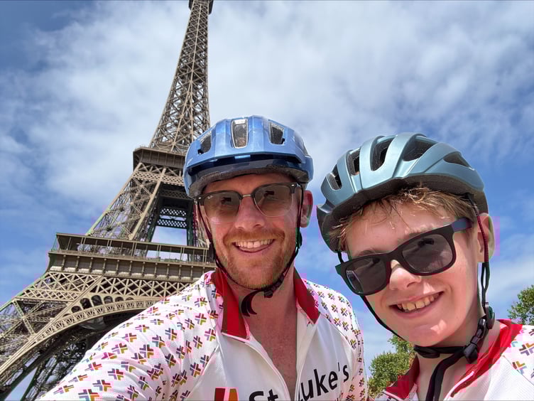 Luke and James Clement, from Horrabridge, at the finish of their epic cycle ride, in front of the Eiffel Tower.