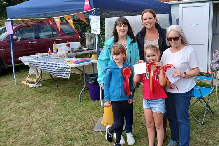 The scarecrow winners with their prizes. Pictured are Maggie and Matilda Vanstone, Claire Pethick and Darcie Ridley and Lynn Pope. They all had help from their menfolk, not pictured.