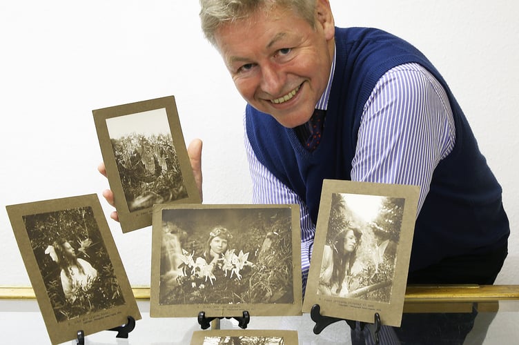 Auctioneer James Laverack with the set of rare fairy photographs that lay unrecognised in an Oke farmhouse drawer for almost a hundred years.