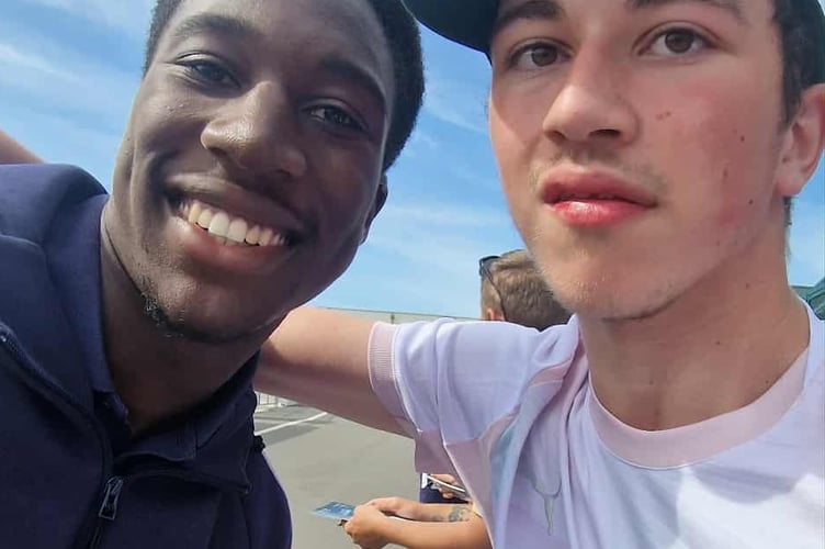 Damien Bowyer and PAFC player Bim who got a hug after the play suffered racist abuse after a match last week.