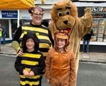 Callington Honey Fair is coming to town. Pictured at a previous event are Lenny-the-Lion (Archie Worth), Bizzy-the-Bee (Jo Worth) and mini-mascots (Fletcher Worth and Mika Pedrick).