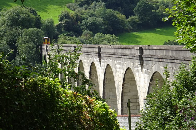 A train crosses the Calstock Viaduct, part of the Tamar Valley Line 