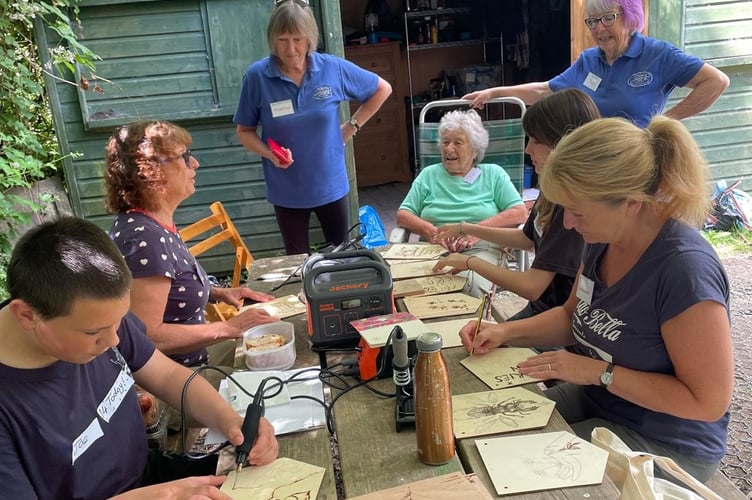 Tavistock memory and Tavistock youth cafes join forces in the woods to enjoy crafting and woodworking to help understand each other's experiences.