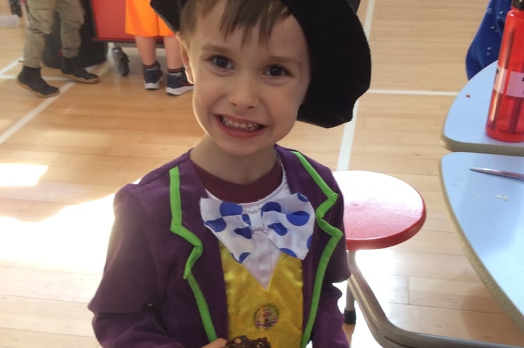 A mini-Willy Wonka enjoys a 'chocolate factory' treat as Horrabridge Primary pupils enjoy a Roald Dahl celebration.
