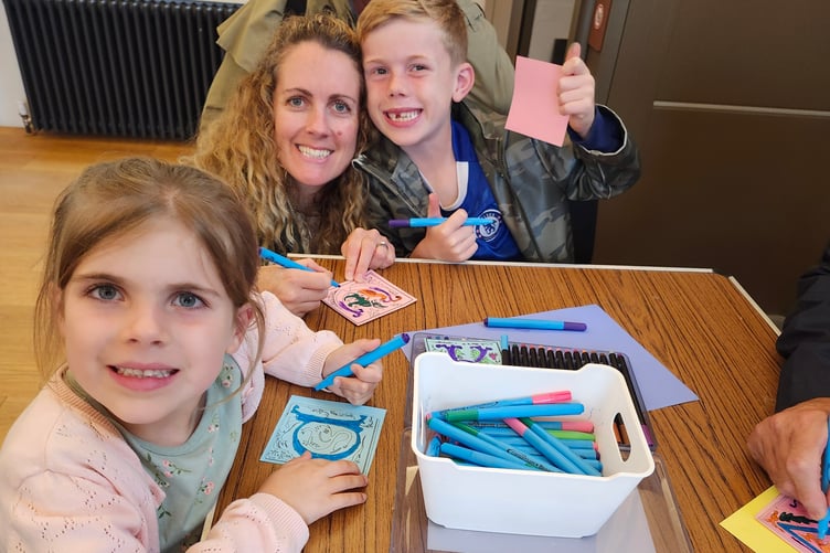 A family joining in the fun uncovering Tavistock's history through art and play.