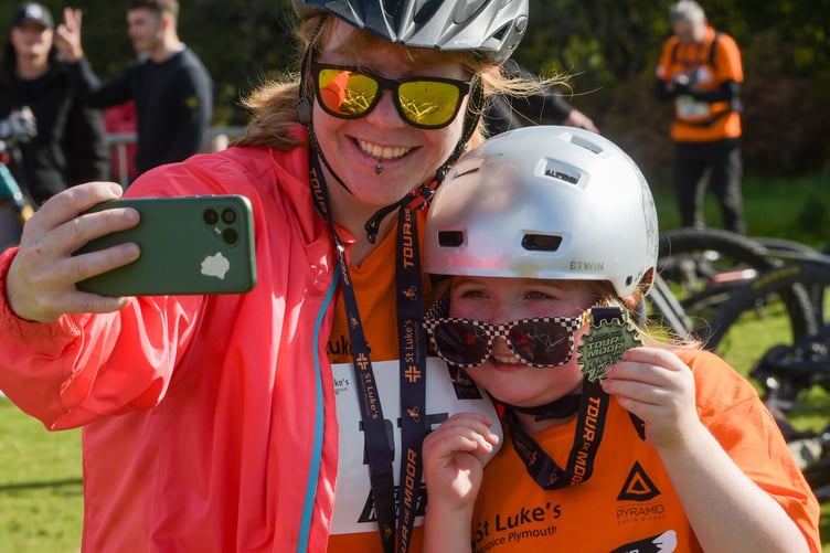 Smiling after completing the St Luke's Hospice Tour de Moor sponsored mountain bike ride at Yelverton. Photo by Paul Slater Images Ltd.